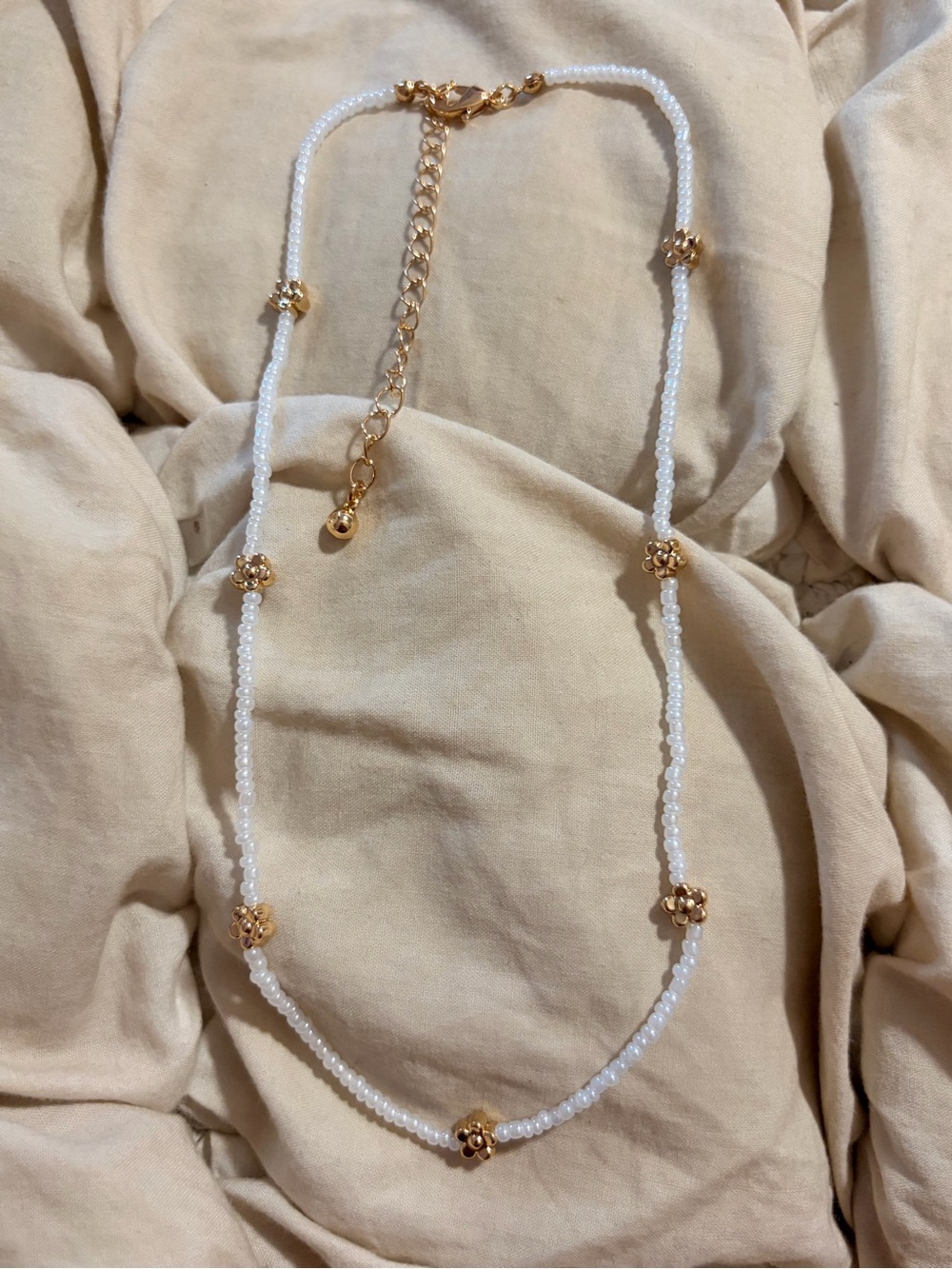 Free People Elegant White Beaded Necklace with Gold Flower Accents